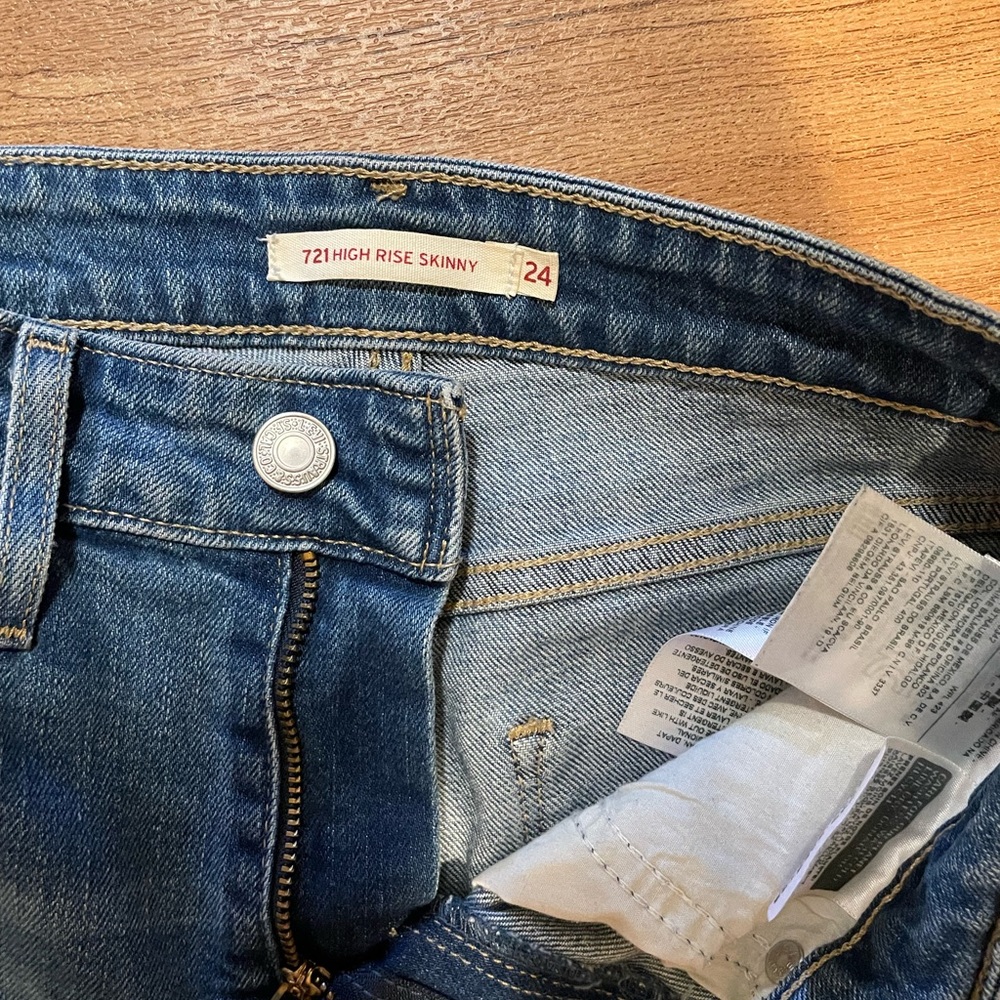 Levi’s 721 high rise skinny distressed jeans